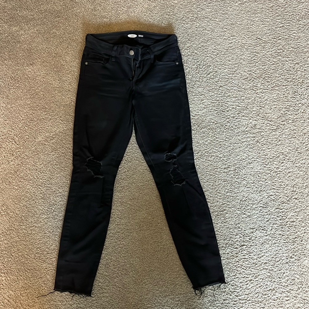 Distressed black skinny jeans